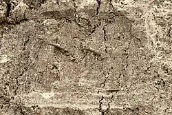 Sar-e Pol-e Zahab, relief III. Beardless warrior trampling a foe, facing a goddess.[17]