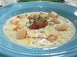 A cream-style seafood chowder prepared with scallops and corn
