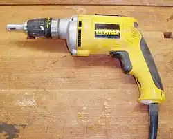 A DeWalt screw gun, used for countersinking drywall screws