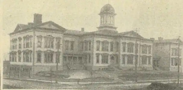 The 1884 Denny School (depicted here in 1900) on Battery Street between Fifth & Sixth Avenues was demolished in 1928, one of many major buildings demolished as part of Denny Regrade No. 2.