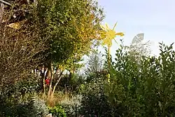 Trees, grasses and two sculptures aboard a former offshore platform converted into an art installation.