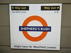 Platform roundel, based on the famous symbol of London Transport, but with Overground orange circle