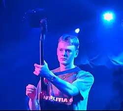 McCay performing as Sign Crushes Motorist in New York City in 2024