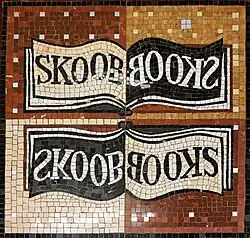Floor mosaic showing the Skoob Books' logo.