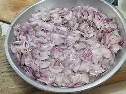 Sliced shallots ready for frying