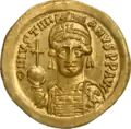 Type of the gold coin of Justinian I discovered in the tomb.[5]