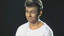 Indian pop star Sonu Nigam with modern adaptation of the Teddy Boy cut