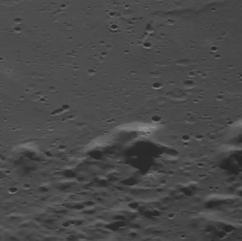 Hollows on a mountain peak within Sousa crater