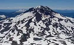 South Sister, which features patches of snow and ice, with Mt Bachelor in the background.