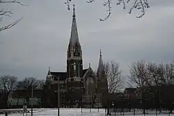 the front of St. Michael's Church from across a snowy baseball field