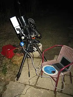 Image 10An amateur astrophotography setup with an automated guide system connected to a laptop (from Observational astronomy)