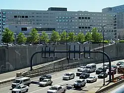 An entrance ramp to a below-grade urban expressway