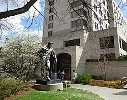 Statue of Hercules at Cornell University, with students in foreground