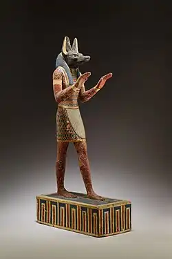 Statuette of Anubis, 332–30 BC, plastered and painted wood, Metropolitan Museum of Art