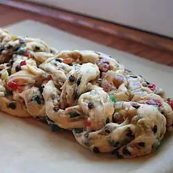 Plaited stollen (Strietzel) with candied fruits and nuts (before baking)