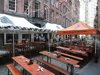 Dining tables and canopies on a portion of the Stone Street Historic District
