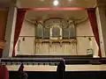 Pipe organ and stage of concert hall seen in 2013
