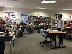 Students act out a mock trial in their classroom