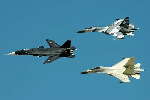 Sukhoi Su-47 Berkut in the lead, followed by a Su-27SKM (top) and a Su-30MKK (bottom).
