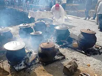 Cooking of Svadbarski Kupus (wedding cabbage) in clay pots, Serbia