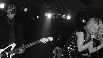 Sweethead in 2009. Pictured: Troy Van Leeuwen (left) and Serrina Sims (right).