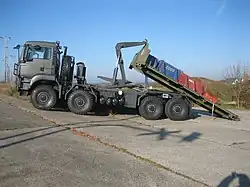 A TG MIL TGS (8x8) with hooklift-type load handling system.