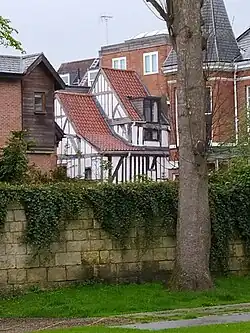 The timber-framed wings at the rear of the building