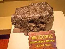 A 166&nbsp;kg (365&nbsp;lb) meteorite at the National Trust's Tatton Park, previously incorrectly labelled as Hoba, identified as Gibeon[10]
