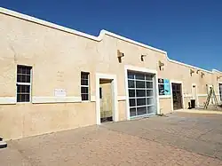 The Borden Milk Company , a.k.a. Creamery and Ice Factory . This particular buildings' address is 1300.
