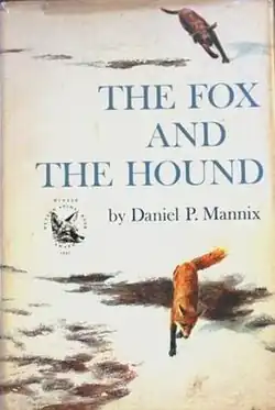A book cover shows a brown dog chasing a red fox through a snowy field. Words on the cover say, "The Fox and the Hound by Daniel P. Mannix".