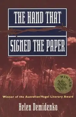 Book cover displaying a field of wheat with a red overlay. The top half of the cover displays the title The Hand that Signed the Paper, while the bottom half displays the name Helen Demidenko.