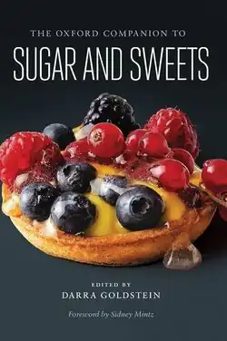 The book cover, featuring a tart covered in berries