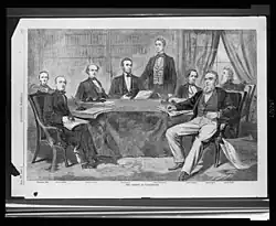 Engraving of men sitting around a table, with one (Seward) standing