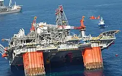 An oil platform listing caused by the hurricane
