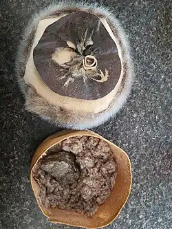 Home made tinder box with cotton. This would be used for the wick.