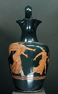 Oinochoe Shape 1, H. 22 cm (8+1⁄2 in), diam. 13.5 cm (5+1⁄4 in), Eos (Dawn) pursuing Tithonus. Attic red-figure, 470–460 BC.