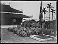 Tú tài graduates kowtowing to the shrine. They also paid respects to examiners and local officials.