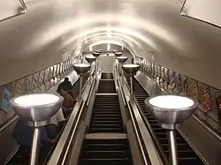 The escalators with uplighters at Tooting Bec