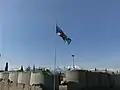 The regimental flag of the Cameron Highlanders of Ottawa flies above a NATO installation near Tora Bora in Afghanistan