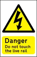 Sign for use at a crossing where the track has an electric live rail or rails