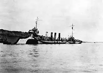 USS Beale (DD-40) moored to a buoy at Queenstown, Ireland, in 1918. She is painted in pattern camouflage.