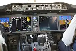 EICAS of a Boeing 787 at the center-left