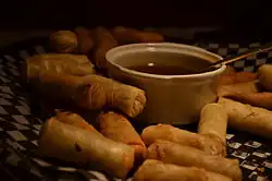 Image 8Spring rolls are a large variety of filled, rolled appetizers or dim sum found in Chinese cuisine. Spring rolls are the main dishes in Chinese Spring Festival (Chinese New Year). (from Chinese culture)