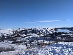 Snowy landscape with blue skies.