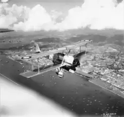 A Vickers Vildebeest Mk III of No. 36 Squadron RAF in flight over Singapore City
