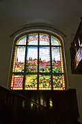 Stained glass with the image of Olomouc in the living room