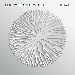 A white background with a white embossing that looks like roots on it