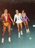 Artistic skating ladies singles gold, silver and bronze medalists (l to r) Anna Conklin (USA), Elena Bonati (ITA) and Tina Kneisley (USA) acknowledge the crowd at the medal ceremony.