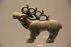 An elk from Longqu (龙渠乡), Zhangye, 475–221 BCE.[15] Shajing culture.[16]