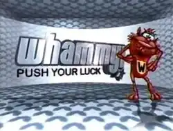 An image of a brown furry creature, over a silver color background. The show title is displayed on the center of the image.